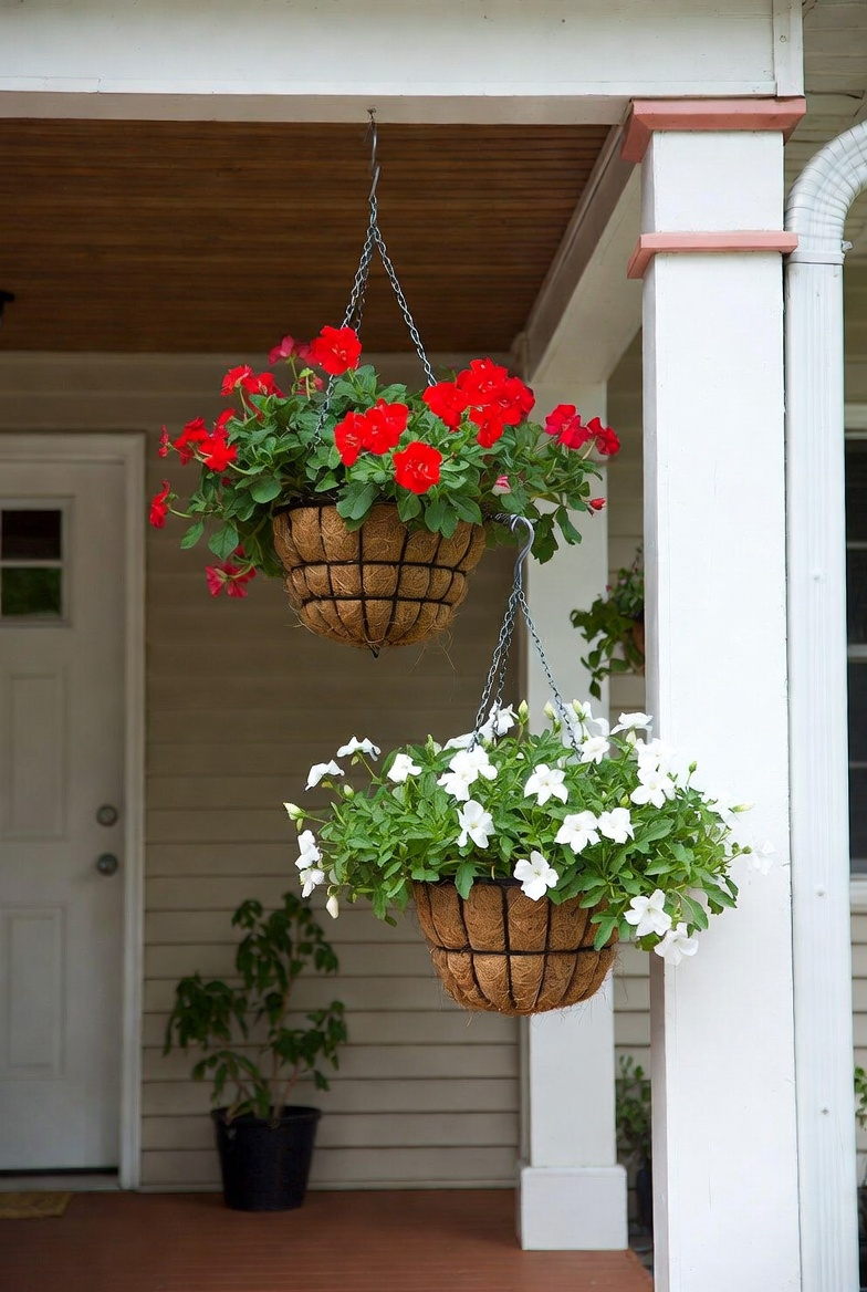 Layered double hanging flower baskets on the porch