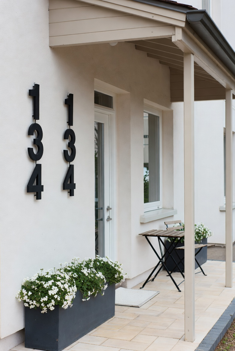 Updated house numbers enhance small front porch curb appeal