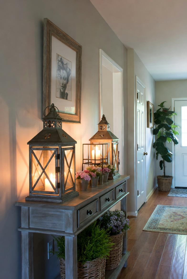 Lanterns and candles creating warm lighting in a spring entryway