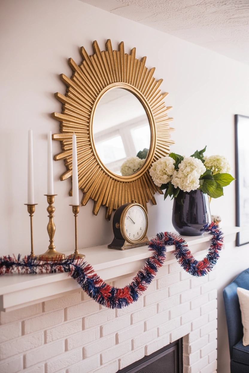 Magazine-worthy 4th of July fireplace mantle with sunburst mirror white candles navy vase and patriotic garland
