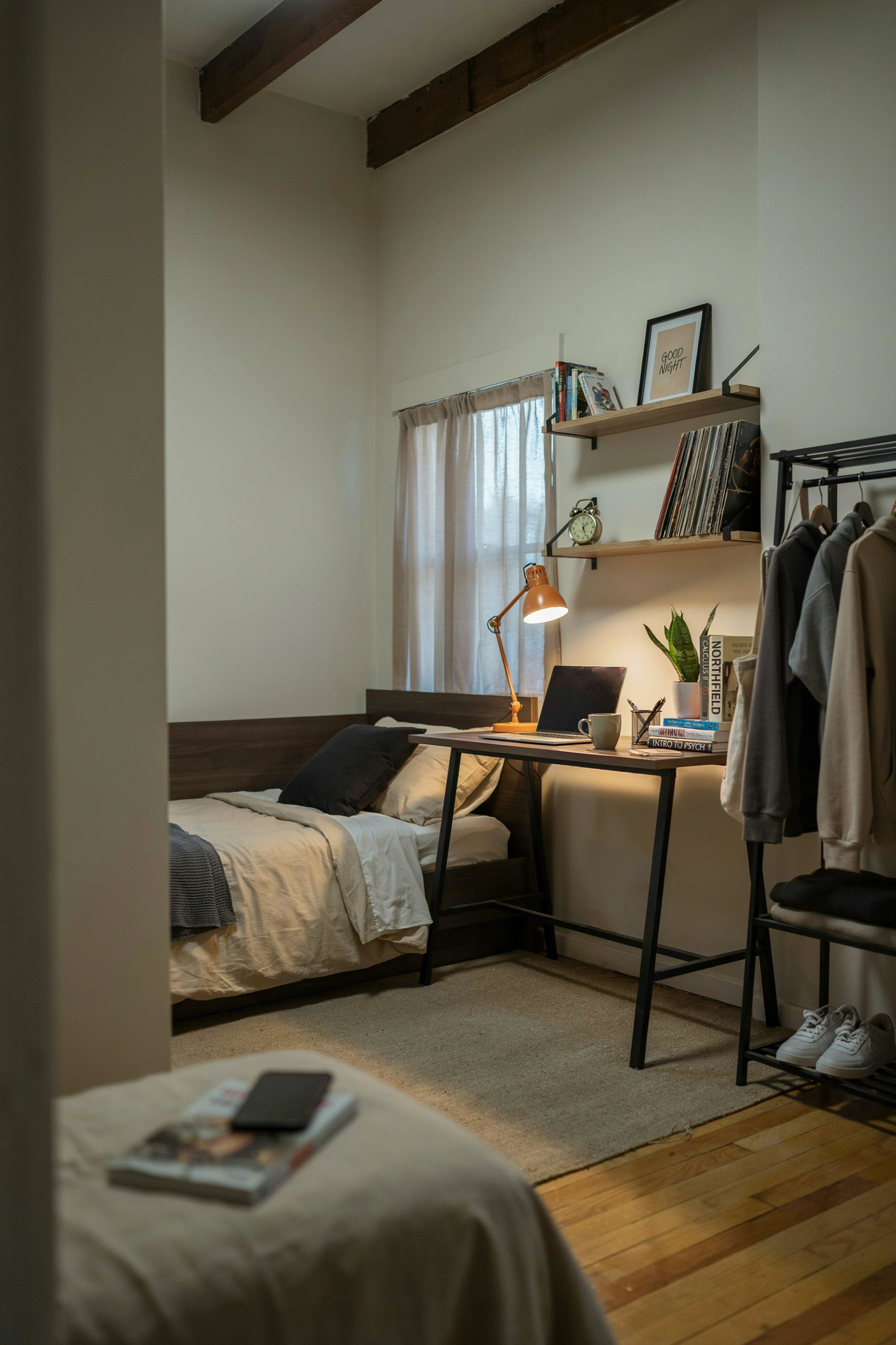 Stylish college bedroom setup for men with modern decor and organized layout