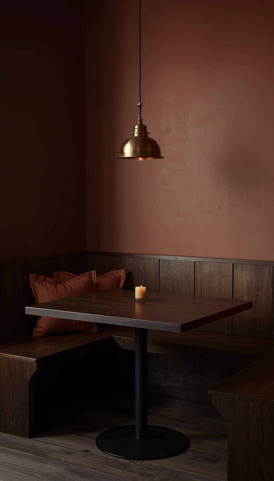 Moody Japandi breakfast nook with dark walnut wood, aged brass pendant, and warm earthy tones
