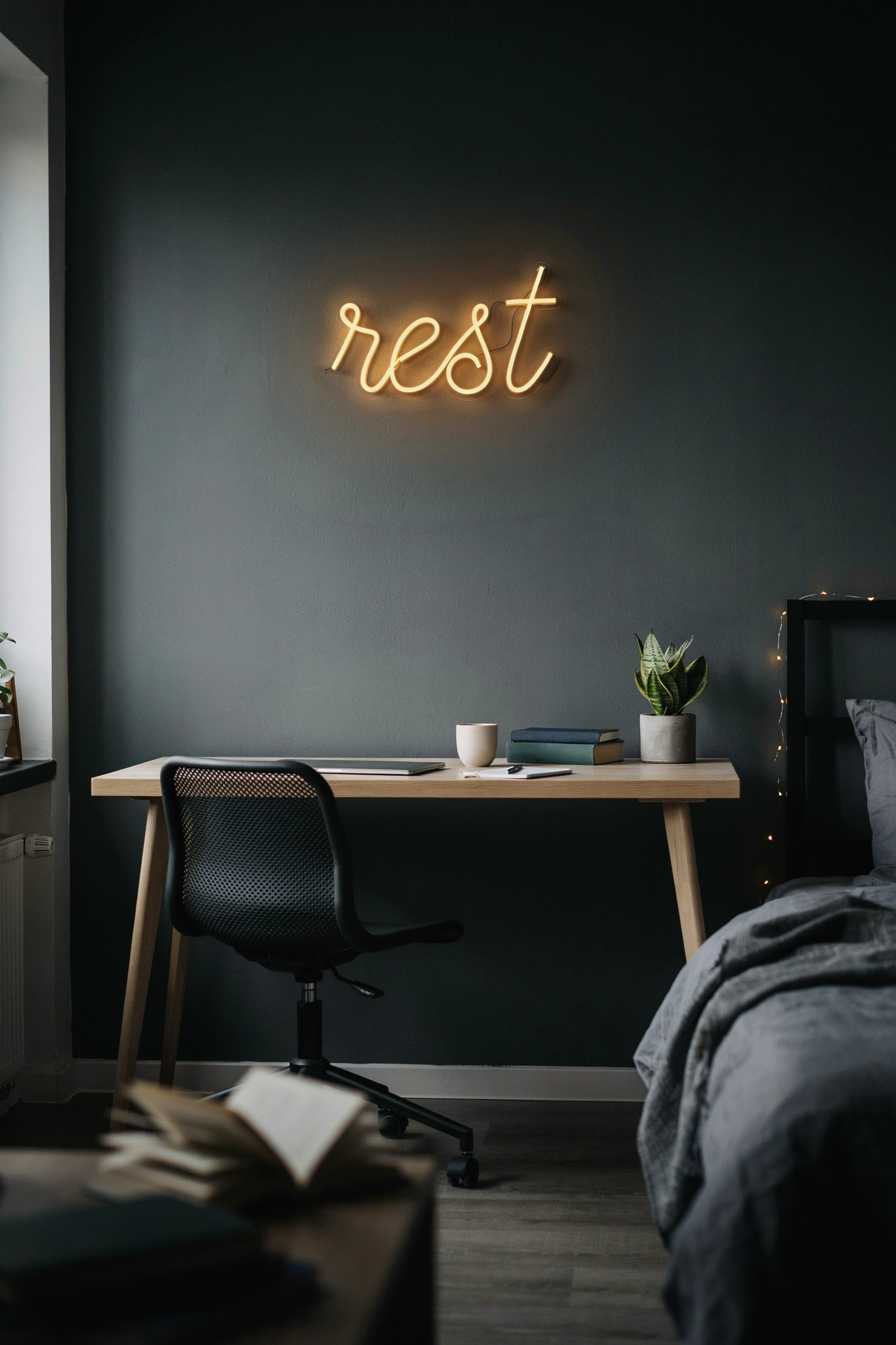 Minimal LED neon sign above college desk — masculine bedroom decor for guys